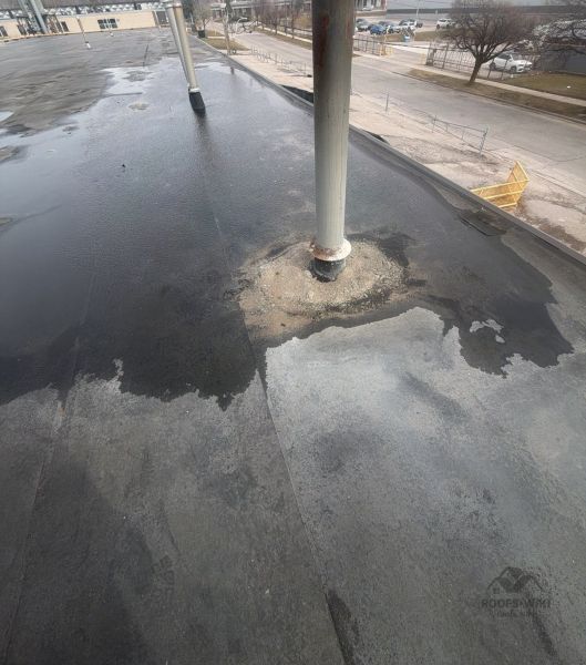 File:Ponding-water-reflecting-on-a-flat-roof-north-york-197.jpg