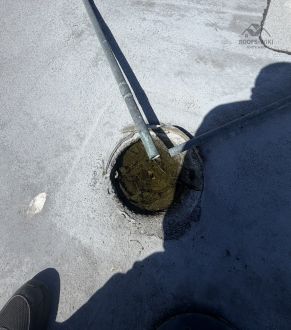 Domed strainer over a roof drain in San Diego, CA