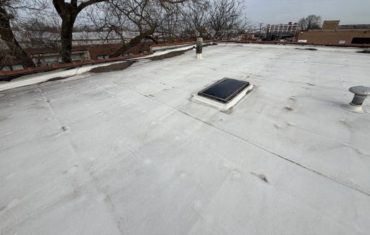 Ponding water and debris on a flat roof in Chicago, IL