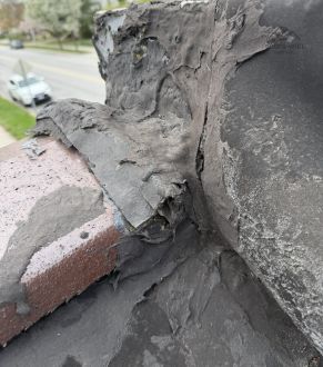 Damaged roof membrane in Lyons, IL