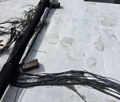 Metal conduit running across a flat roof in Van Nuys, CA