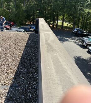 Ridge line of an asphalt shingle roof in Charlotte, NC