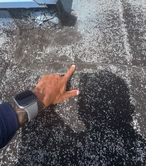 Roof drain with debris on a flat roof in Orlando, FL