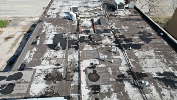 Flat roof tear-off underway in Westchester, IL
