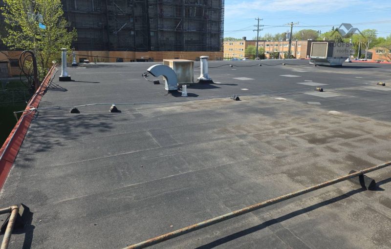 File:Ponding-water-with-rust-staining-on-a-flat-roof-winnipeg-b2-140.jpg