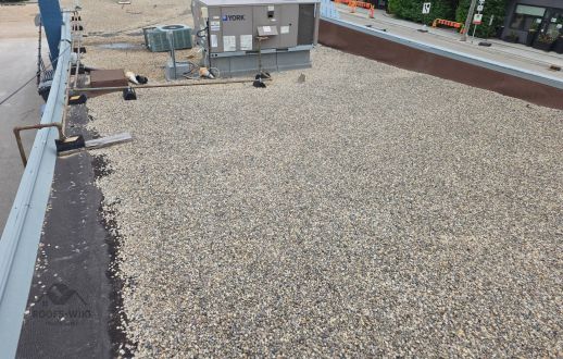 Ballasted gravel roof with rooftop equipment in Winnipeg, MB
