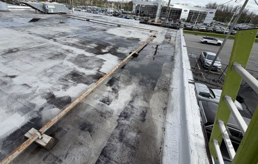 Parapet edge of a flat commercial roof in Downers Grove, IL