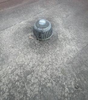 Mushroom vent cap on a flat roof in Toronto, ON