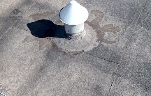 Ponding and patching on a flat roof in Toronto, ON